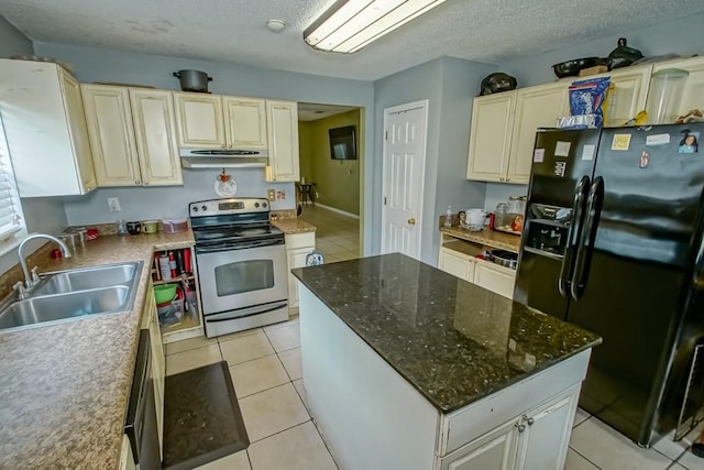 1210 Montgomery Blvd, Slidell, LA 70461 - kitchen with black fridge with ice dispenser, stainless steel range with electric stovetop, under cabinet range hood, light tile patterned flooring, and a textured ceiling