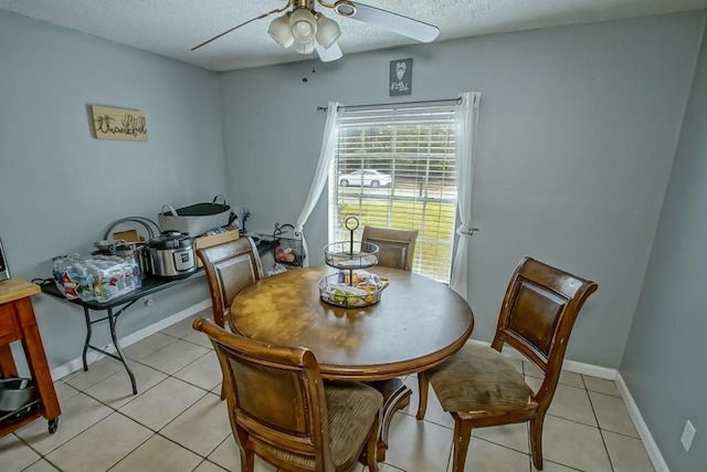 1210 Montgomery Blvd, Slidell, LA 70461 - dining room with a ceiling fan, light tile patterned floors, and a textured ceiling