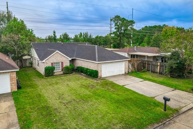 ranch-style house with a front yard and a garage