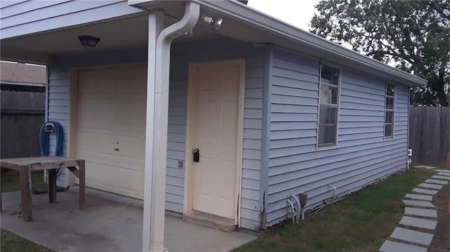 view of property exterior with a garage