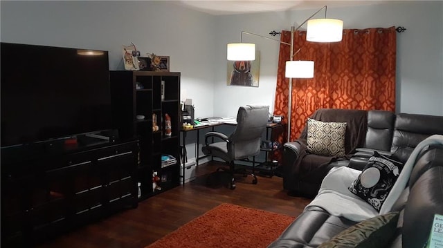 home office with dark hardwood / wood-style flooring