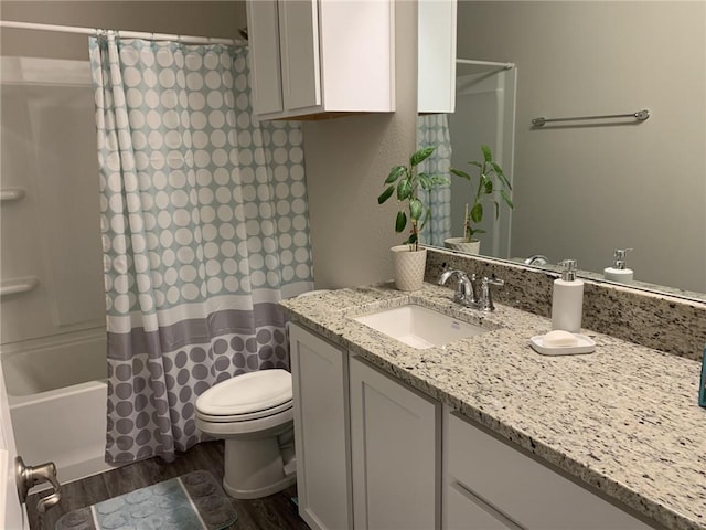 full bathroom with wood-type flooring, vanity, toilet, and shower / bath combo