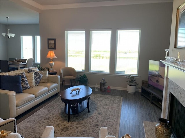 living room featuring dark hardwood / wood-style flooring and a notable chandelier