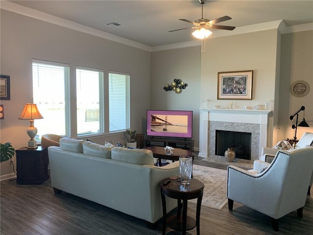 living room with dark hardwood / wood-style floors, ceiling fan, and crown molding