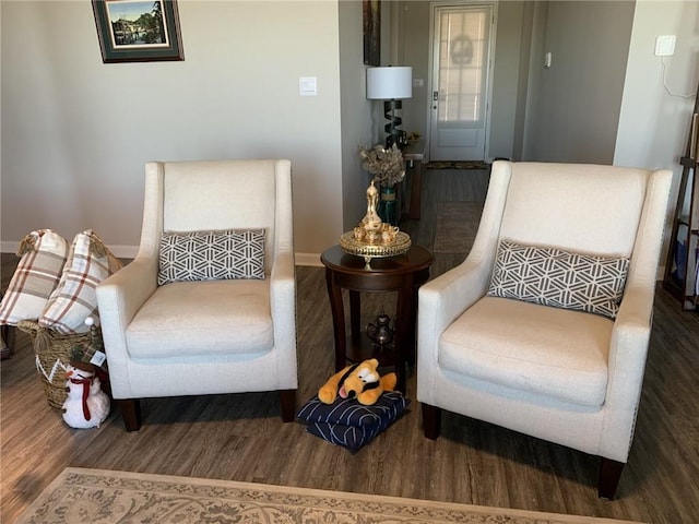 sitting room with hardwood / wood-style flooring