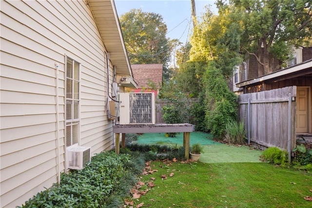 view of yard featuring ac unit and central AC