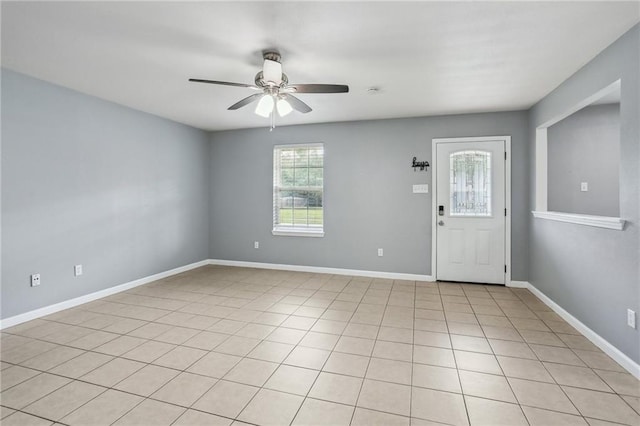 entryway with light tile patterned floors and ceiling fan