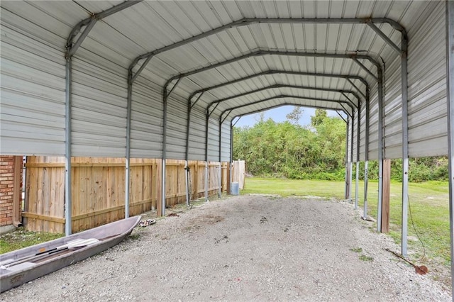 view of car parking with a yard and a carport