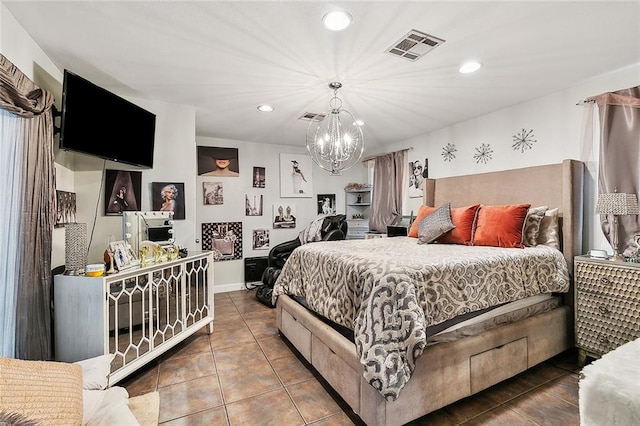 tiled bedroom featuring a chandelier