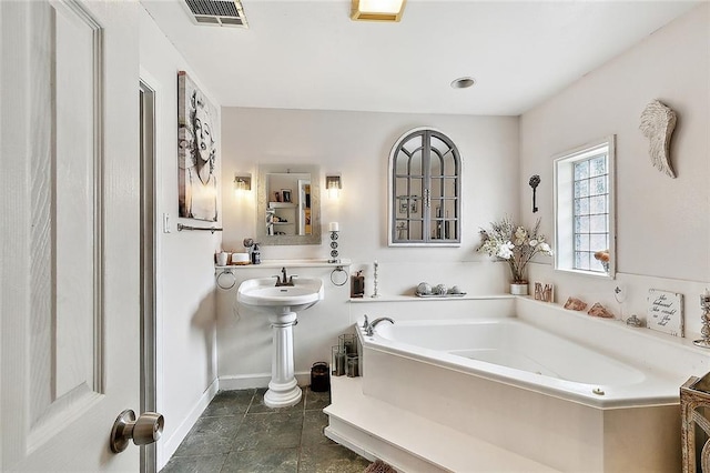 bathroom featuring a washtub