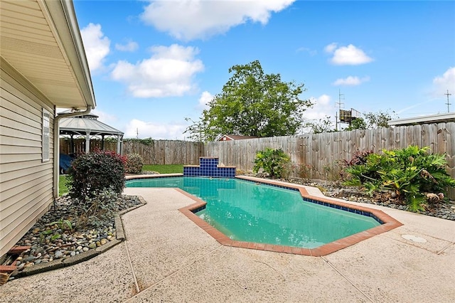 view of swimming pool featuring a gazebo and a patio