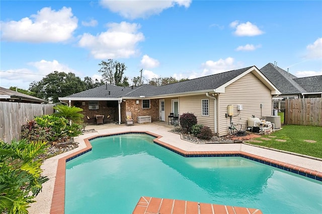 view of pool featuring cooling unit and a patio area