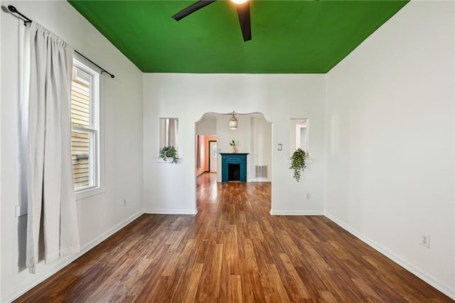 empty room with wood-type flooring and ceiling fan