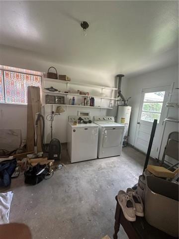 garage featuring washer and clothes dryer and gas water heater