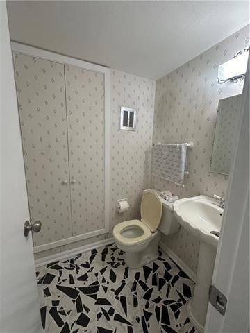 bathroom featuring tile patterned floors and toilet