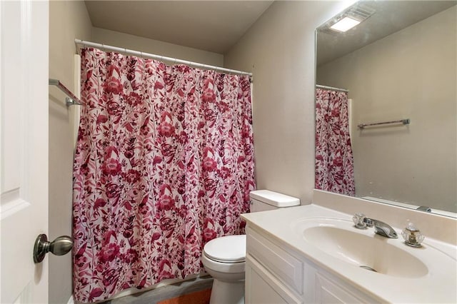 bathroom with hardwood / wood-style floors, vanity, and toilet