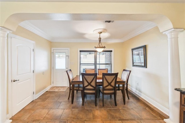 dining room with ornate columns and ornamental molding