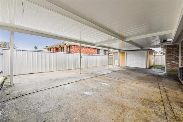 view of patio with an outdoor structure and a garage