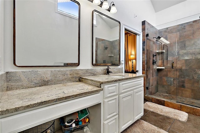 bathroom with vanity, tile patterned floors, and a shower with shower door