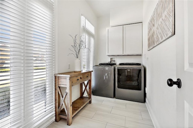 laundry room with cabinets and independent washer and dryer