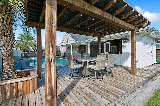 wooden terrace featuring a fenced in pool