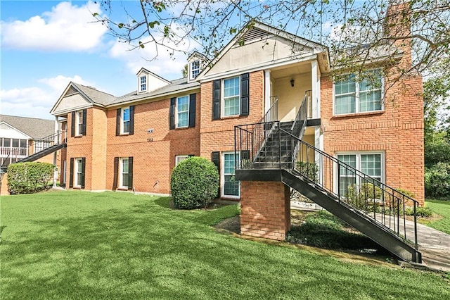 rear view of house with a lawn