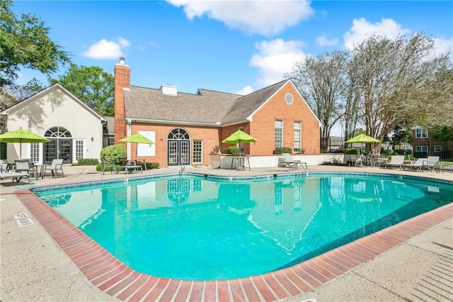 view of swimming pool with a patio area