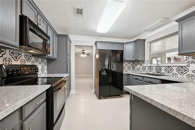 kitchen with backsplash, ceiling fan, crown molding, black appliances, and gray cabinets