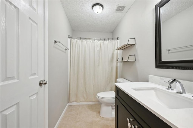 bathroom with vanity, tile patterned floors, a shower with shower curtain, toilet, and a textured ceiling