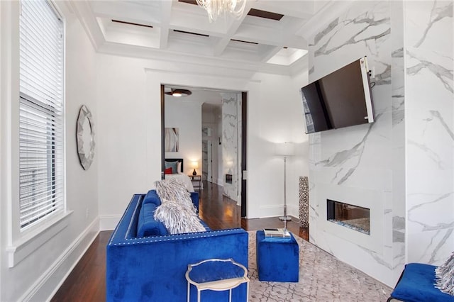 living room with beamed ceiling, hardwood / wood-style flooring, and coffered ceiling