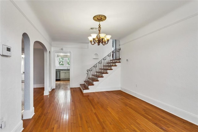 entryway with a chandelier and hardwood / wood-style floors