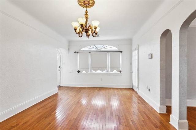 foyer featuring a notable chandelier and hardwood / wood-style flooring