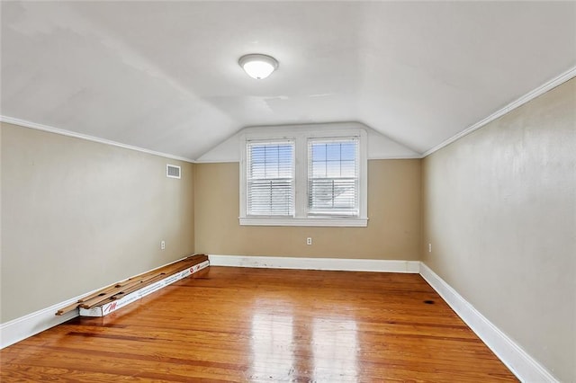 bonus room featuring hardwood / wood-style floors and lofted ceiling