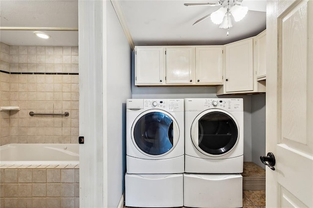 laundry room featuring tile patterned flooring, ceiling fan, cabinets, and washing machine and clothes dryer