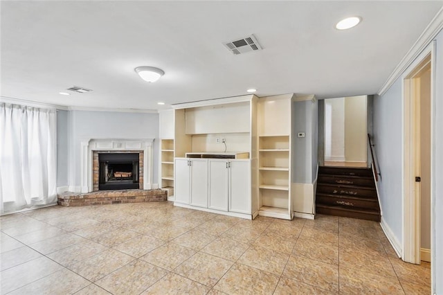 unfurnished living room with crown molding, light tile patterned floors, and a brick fireplace