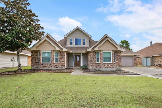 view of front facade with a front yard and a garage