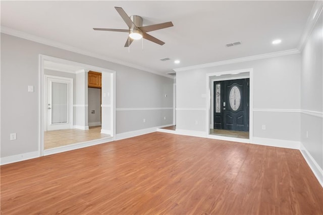 unfurnished living room featuring light hardwood / wood-style floors, ceiling fan, and crown molding