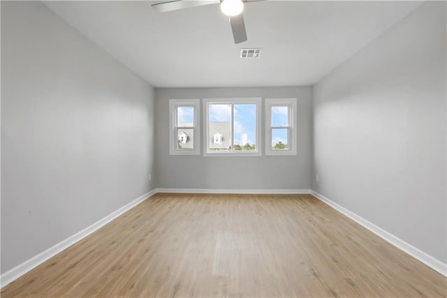 spare room with ceiling fan and light hardwood / wood-style flooring