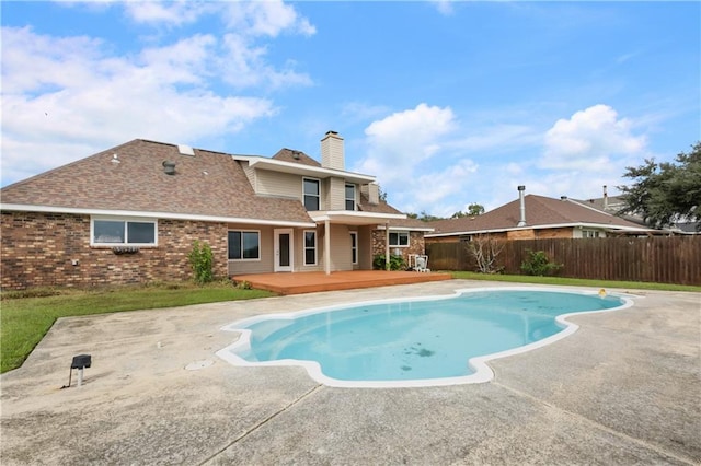 view of swimming pool with a wooden deck