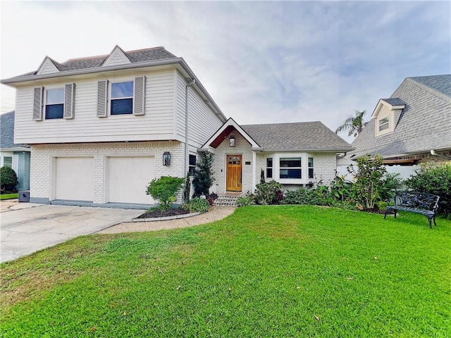 view of front of home with a front yard and a garage