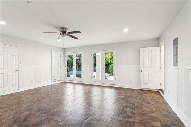 spare room with electric panel, ceiling fan, and french doors