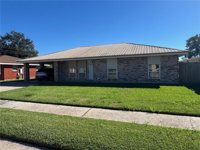 ranch-style home featuring a front yard and a carport