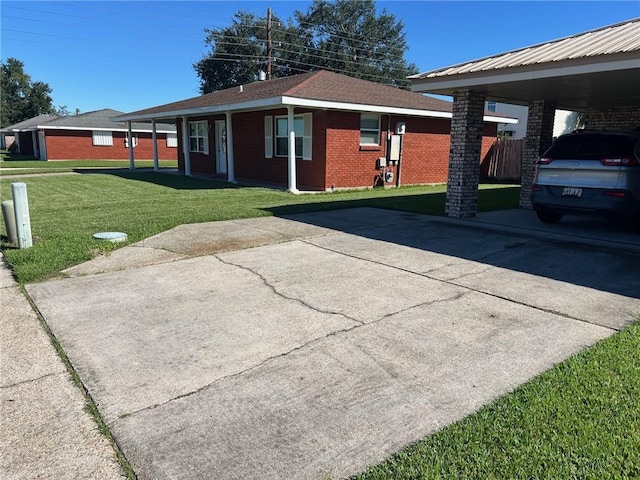 view of home's exterior featuring a carport and a lawn