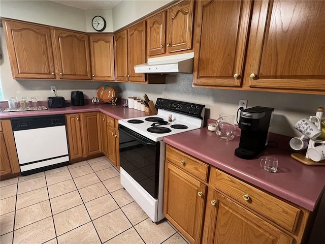 kitchen featuring white appliances and light tile patterned floors