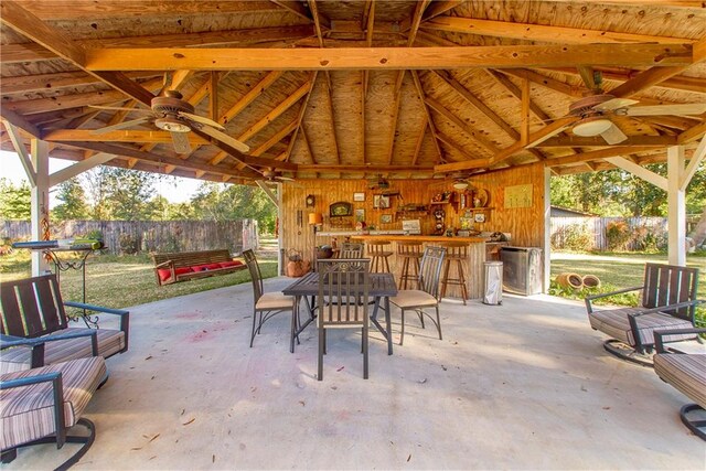 view of patio / terrace with a gazebo, a bar, and ceiling fan