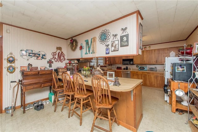 kitchen with stainless steel dishwasher, ornamental molding, and kitchen peninsula