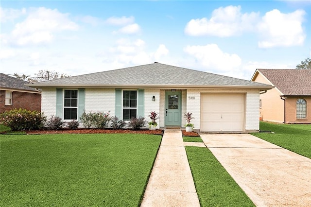 single story home featuring a front yard and a garage