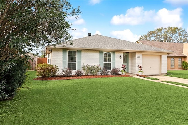 ranch-style home with a front yard and a garage