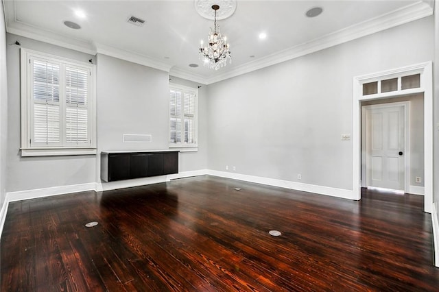 unfurnished living room featuring crown molding, plenty of natural light, a chandelier, and wood-type flooring