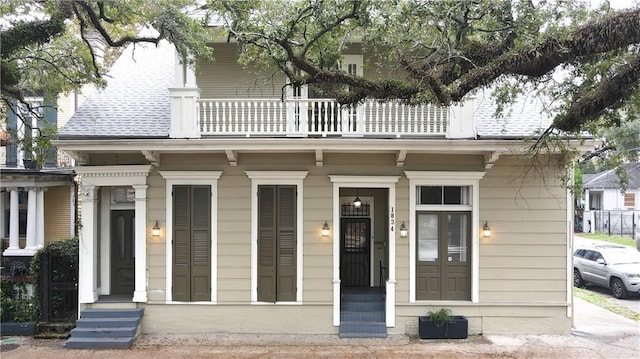 view of front of property with a balcony